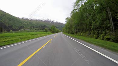 Driving a Car on a Road in Norway