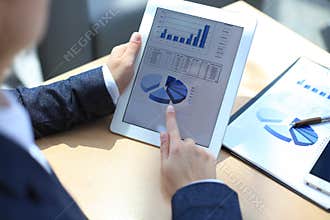 Business person analyzing financial statistics