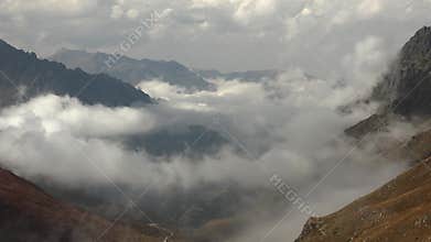 Patagonia Argentina mountain valley catches clouds between sharp ridges and dawn light, mountains, andes, south america, andean