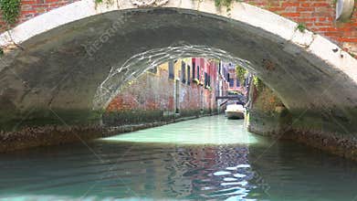 Gondola glides through Venice canal with romantic travel mood classic water transport detail, boat, along, carries, venetian