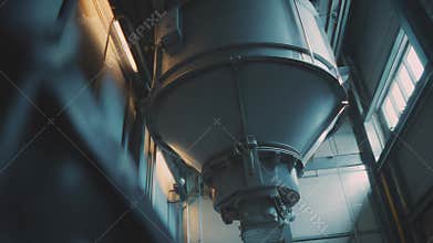 Industrial silo processing material at manufacturing facility