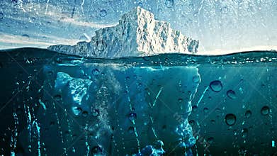 Massive Iceberg Underwater Split View.