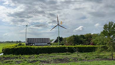 Amsterdan Forest, Wind turbine showing visible action, in open field with grass