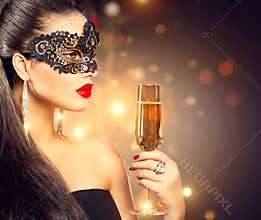 Woman wearing carnival mask with glass of champagne