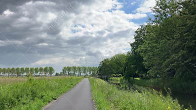 Rural Amsterdam, Quiet rural Amsterdam path beside canal leading toward wooden