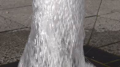 Blur city small fountain water splash on pavement