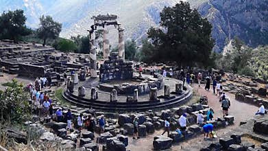 DELPHI, GREECE - CIRCA 2014: Tourists at Delphi attending religious ceremony