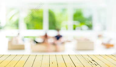 Empty wood table and blurred living room background.