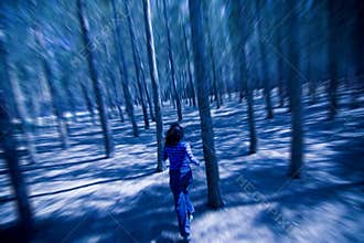 Woman escaping through the woods