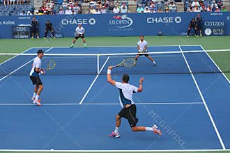 Grand Slam champions Mike and Bob Bryan (at the front) during US Open 2014 round 3 doubles match