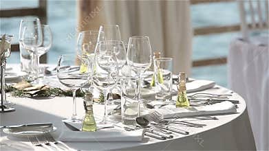 Served table in a restaurant on the beach in Europe at sunset