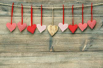 Sweet red hearts on wooden background. Valentines Day