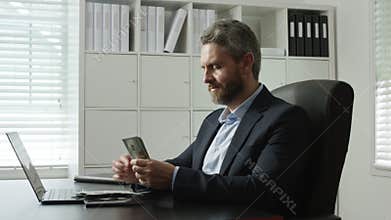 Office worker counting money in accounting office. Banker counting money for payment processing. Man counting money in business