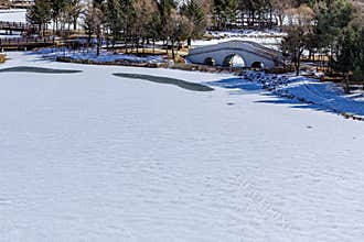 Early Spring Snow - Yulun Bridge Scenery in Jingyuetan National Forest Park, Changchun, China