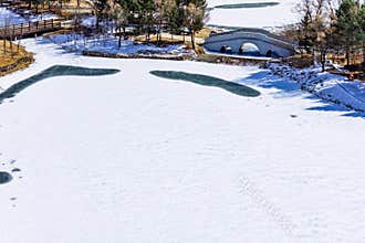 Early Spring Snow - Yulun Bridge Scenery in Jingyuetan National Forest Park, Changchun, China