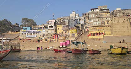 Varanasi or Banaras Ghats Riverside View from Boat on Ganges River, Colorful Boats and Historic Banaras City Scene