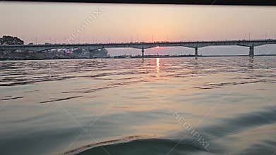 Golden Sunset Over River with Boats in India Scenic Water Reflection Cinematic Evening Landscape
