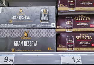 DENIA, SPAIN - Juny 18, 2026.Multi packs of Cruzcampo Gran Reserva and San Miguel Selecta beers on grocery shelf in Spain