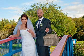 Bride and groom on bridge