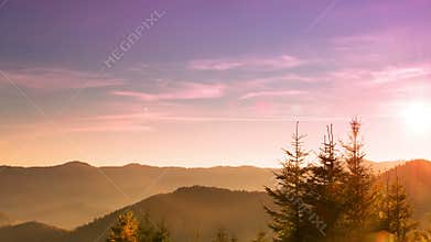 Sunrise over the Forested Mountains. Time Lapse 4K