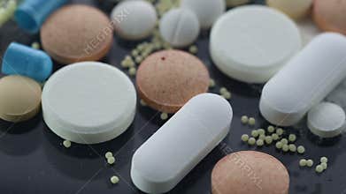 Drug Addiction Concept. Macro film of powder by open pills
