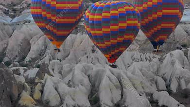 Hot air balloons drift above Cappadocia fairy chimneys and volcanic valleys, travel, sky, turkiye, balloon ascent