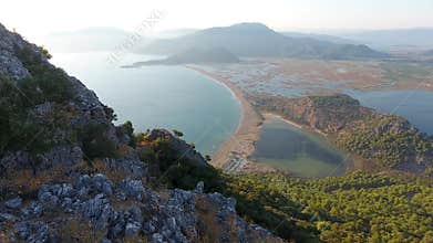 Panoramic drone view of Dalyan lagoon lake forest and mountains above reed filled wetlands, reeds, delta, mugla, turkiye