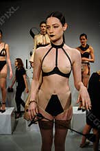 NEW YORK, NY - OCTOBER 25: Models pose during Love Cage Spring 2015 lingerie presentation