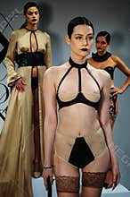 NEW YORK, NY - OCTOBER 25: Models pose during Love Cage Spring 2015 lingerie presentation