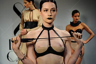 NEW YORK, NY - OCTOBER 25: Models pose during Love Cage Spring 2015 lingerie presentation