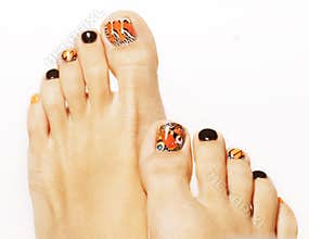 Pedicure with butterfly design isolated on white