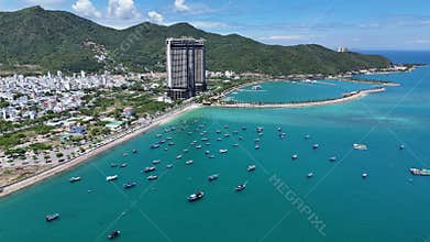 Aerial view of Ana Marina Nha Trang. Wooden fishing boats in a blue sea. Northern part of city, central Vietnam