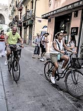 People going about their daily lives in the streets of the city of Valencia