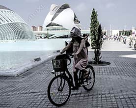People going about their daily lives in the streets of the city of Valencia