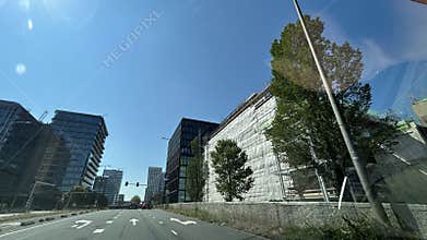 Sunny modern business district street with glass office towers, wrapped