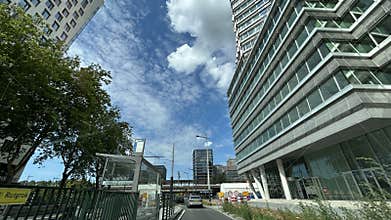 Modern office towers and urban street view in Amsterdam Zuid with cars