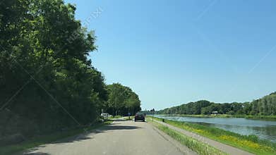 Driving on highway and rural roads near Amsterdam, Netherlands, with farmland and
