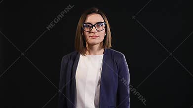 Amazed businesswoman screaming dark background