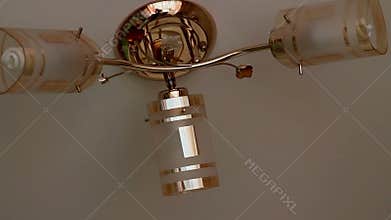 Beautiful kitchen chandelier on a cream background
