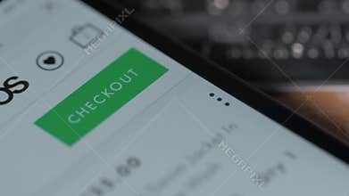 Close-up Of A Person`s Hand Adding Items In Shopping Cart On Online Shopping App