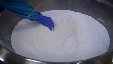During the manufacturing process at a chemical plant control kompanentov purity. Specialist in haschitnom suit and glove