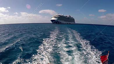 Boat sails away from cruise ship