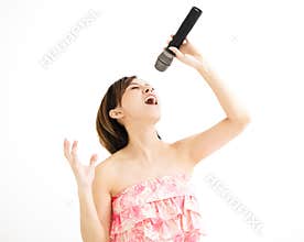Beautiful young woman singing karaoke