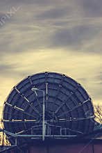 Very Large Array satellite dishes in Voronezh, Russia. Sunset sky background.