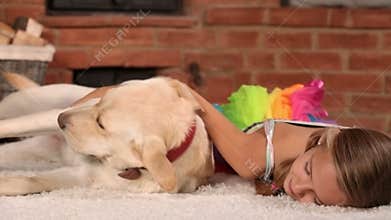 Girl relaxing with her playful dog