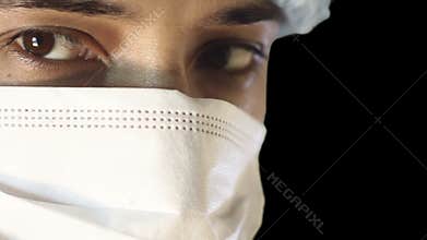Macro close-up of human eye. A man in a medical mask and cap. busy surgery
