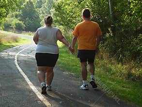 Large people walking on trail