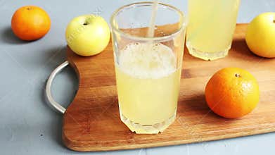 In glass filled with juice and placed straw to drink