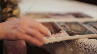 Old Woman Looking At A Photo In Old Photo Album, Memories, Tilt Up