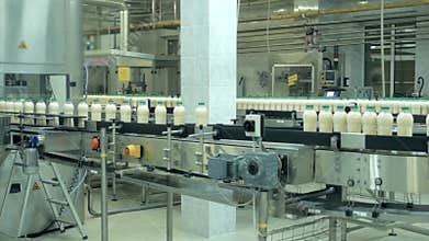 Milk production on line at the factory, a lot of bottles